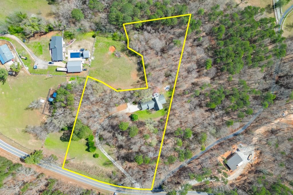 5050 Cagle Mill Road Lula, GA 30554 - Photo 48 of 48 a aerial view of a house with a yard and large trees