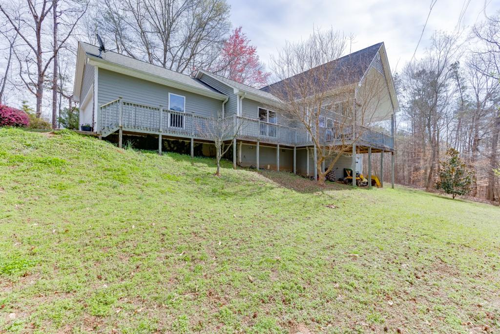 5050 Cagle Mill Road Lula, GA 30554 - Photo 5 of 48 a house that has a tree in front of it