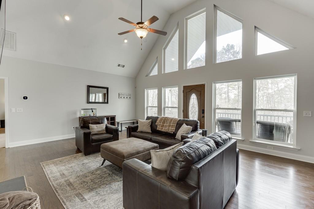 5050 Cagle Mill Road Lula, GA 30554 - Photo 9 of 48 a living room with furniture and a large window