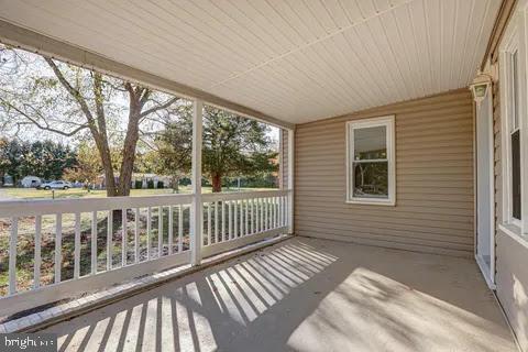 4841 Sandtown Road Felton, DE 19943 - Photo 3 of 44 Charming porch with serene views.