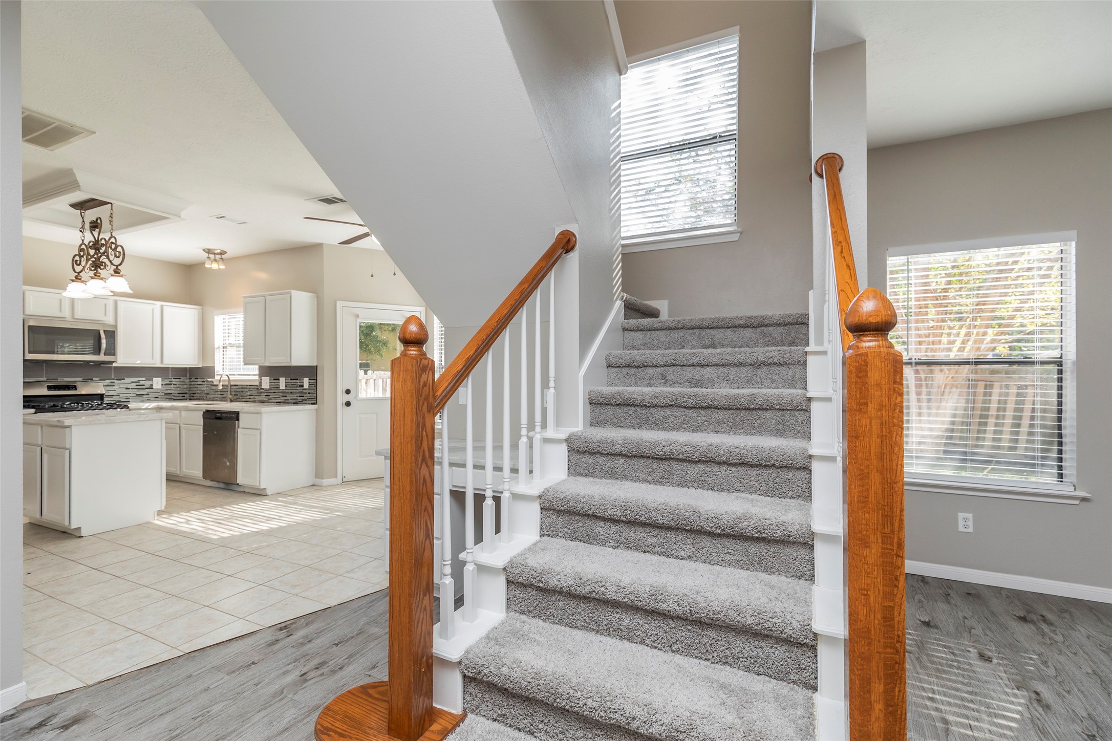13110 Mills River Street Houston, TX 77070 - Photo 12 of 39 a view of kitchen with sink microwave and cabinets
