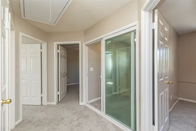 a view of a bathroom with a glass door shower