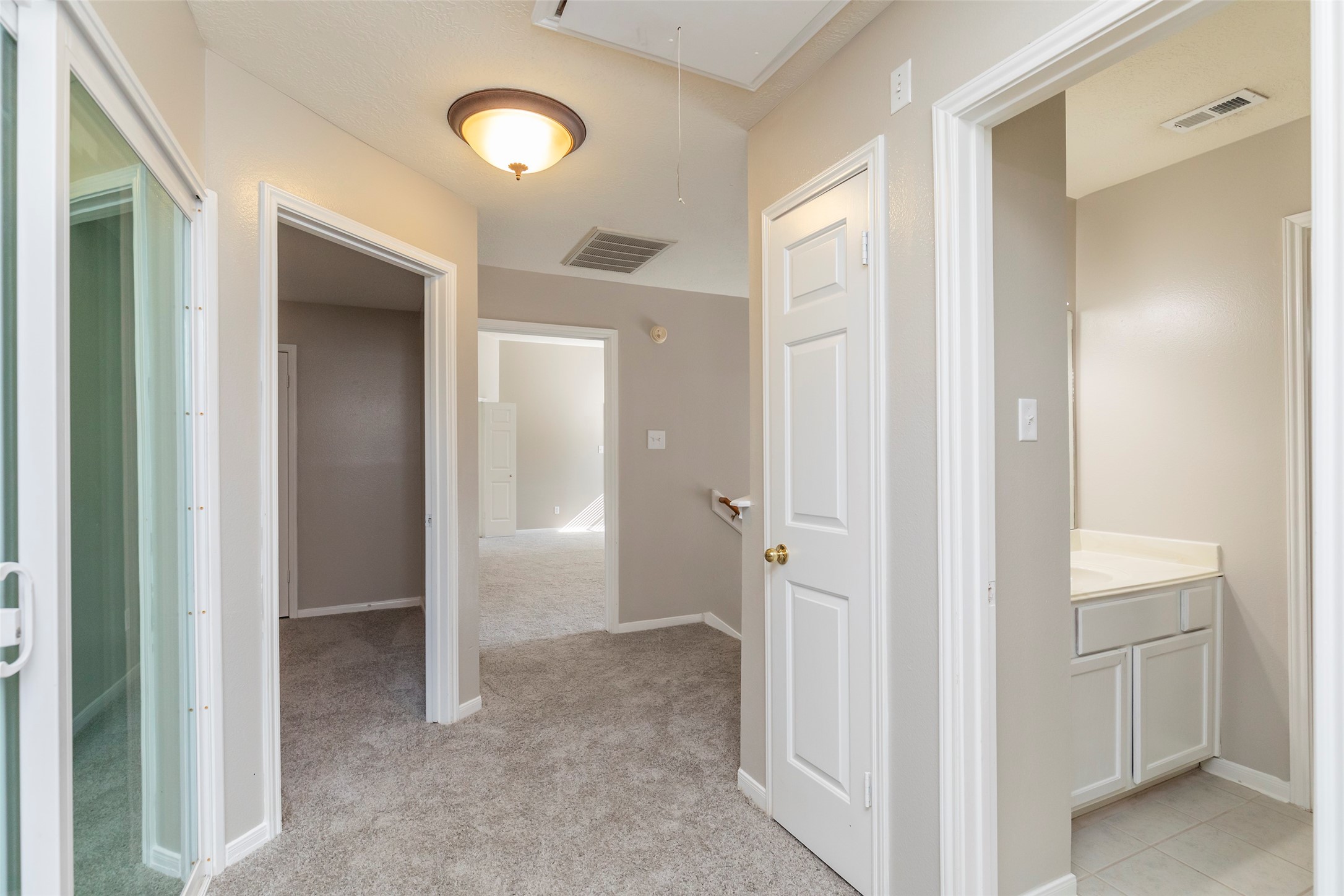 13110 Mills River Street Houston, TX 77070 - Photo 30 of 39 a view of a bathroom with a glass door shower