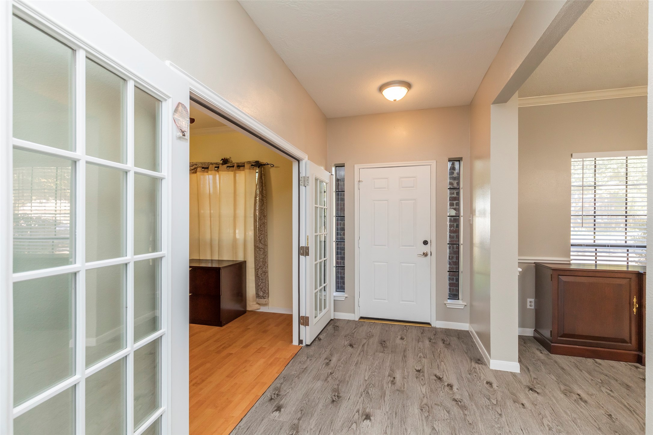 13110 Mills River Street Houston, TX 77070 - Photo 3 of 39 a view of empty room with wooden floor and windows