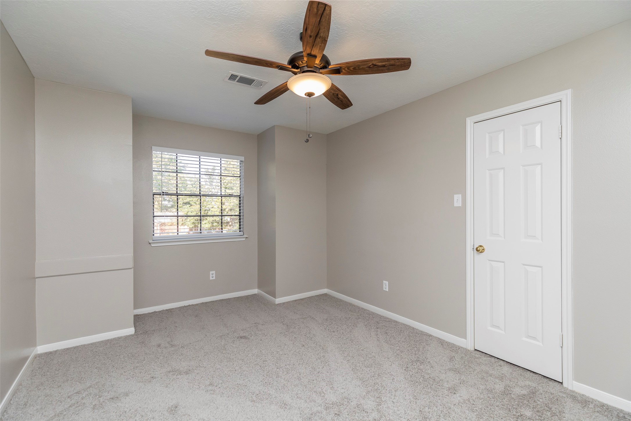 13110 Mills River Street Houston, TX 77070 - Photo 31 of 39 a view of an empty room with a window
