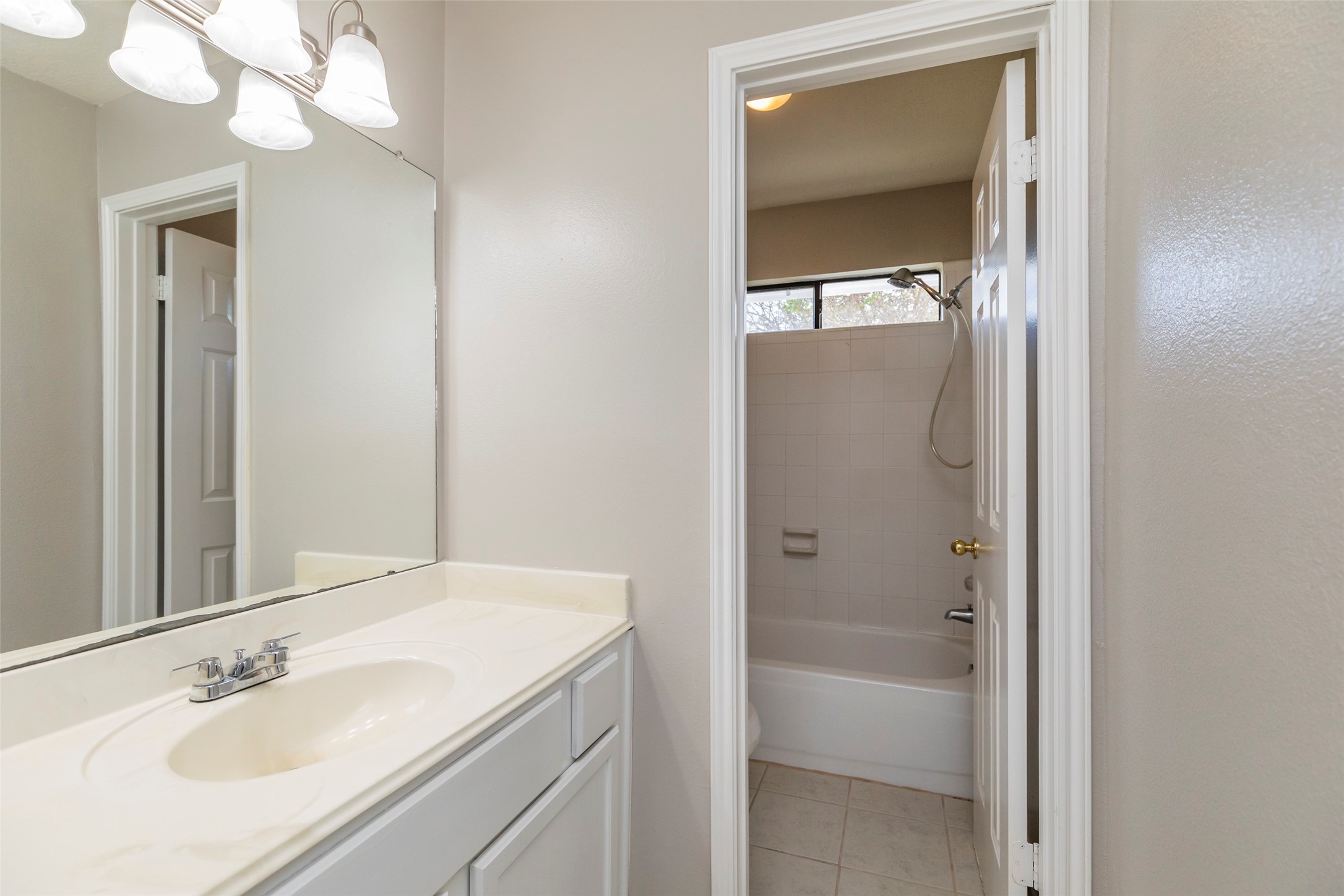 13110 Mills River Street Houston, TX 77070 - Photo 32 of 39 a bathroom with a sink a shower and a mirror