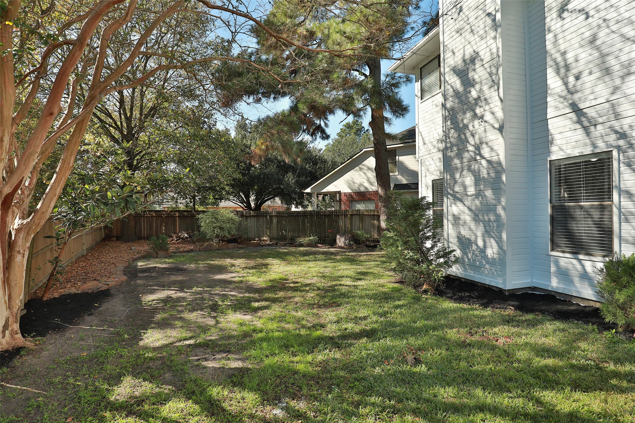 13110 Mills River Street Houston, TX 77070 - Photo 37 of 39 a large tree in middle of the garden