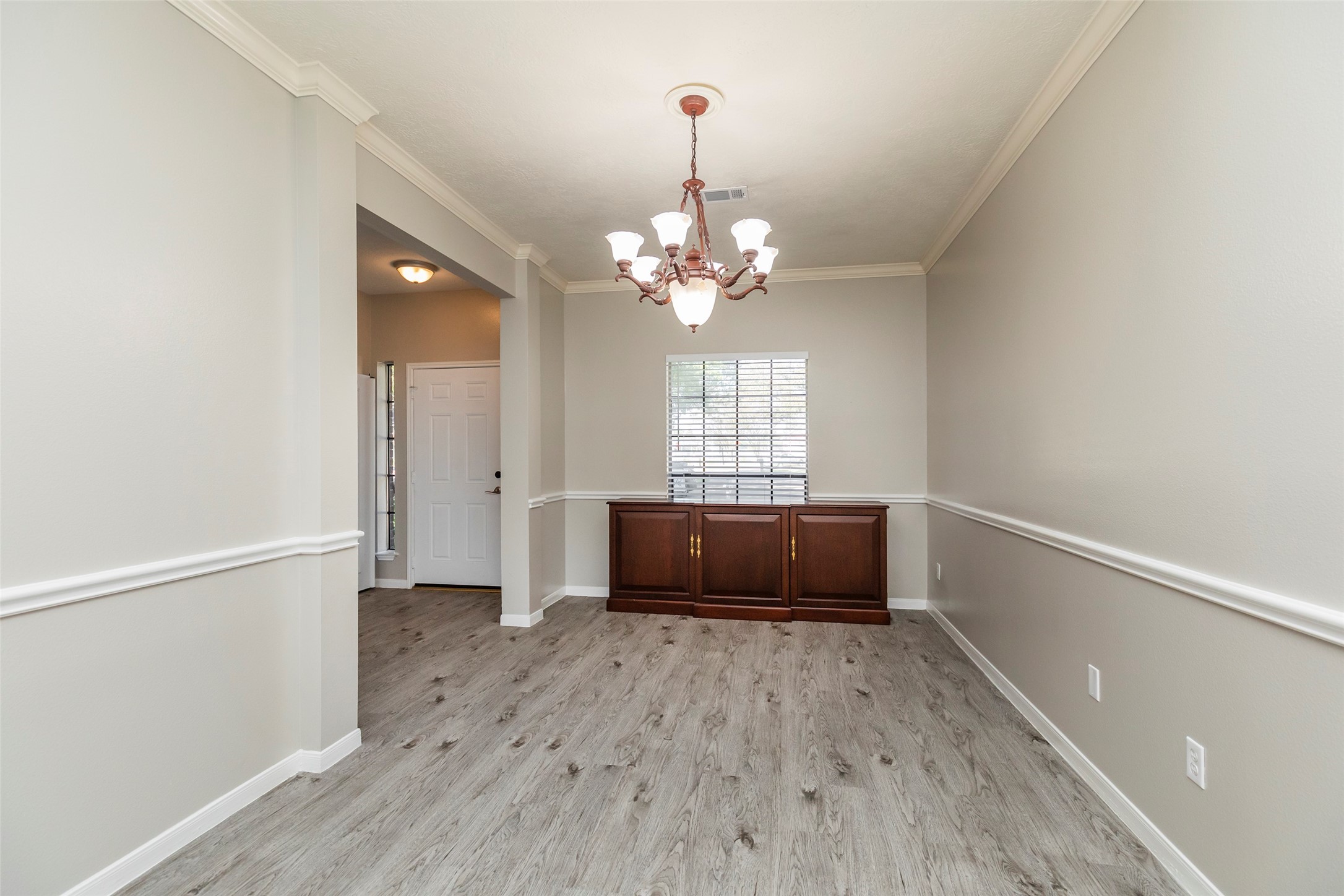 13110 Mills River Street Houston, TX 77070 - Photo 4 of 39 wooden floor in an empty room with a window
