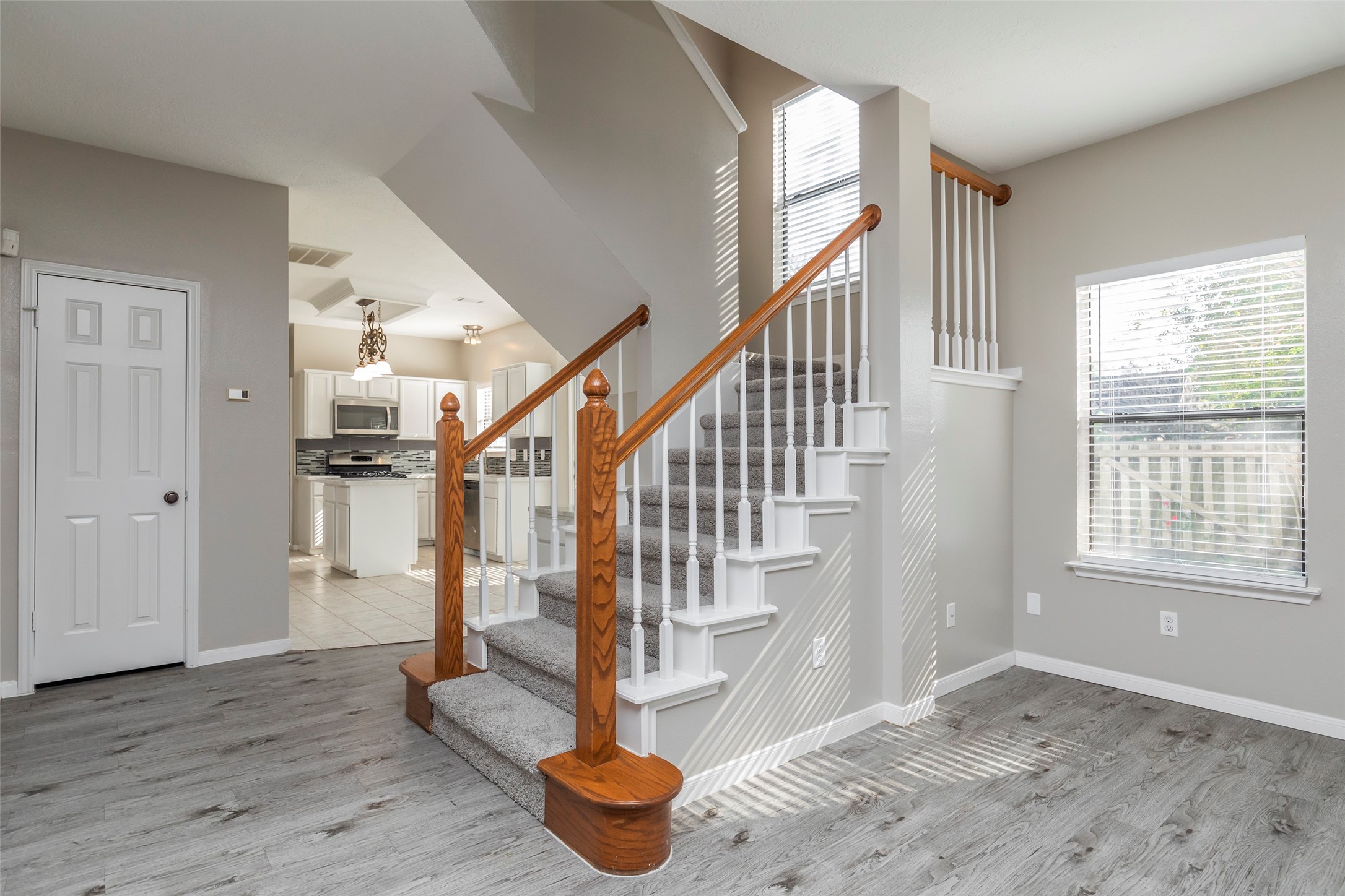 13110 Mills River Street Houston, TX 77070 - Photo 10 of 39 a view of entryway and hall with wooden floor
