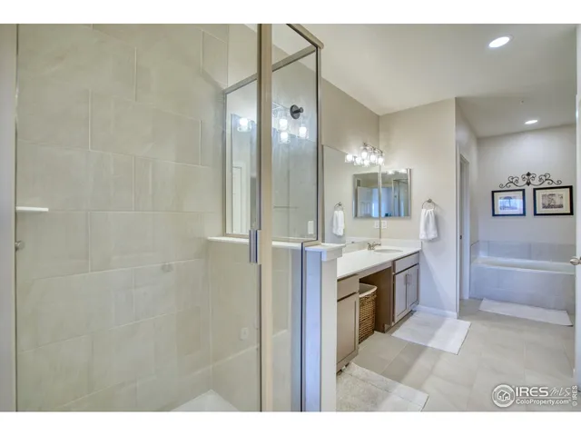 a large bathroom with a double vanity sink and a mirror
