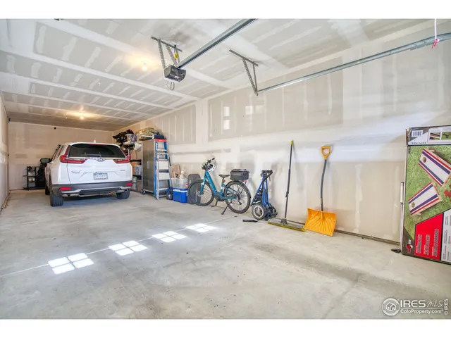 a view of a garage with rack and bicycle