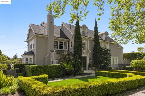 a view of a house with swimming pool and a garden