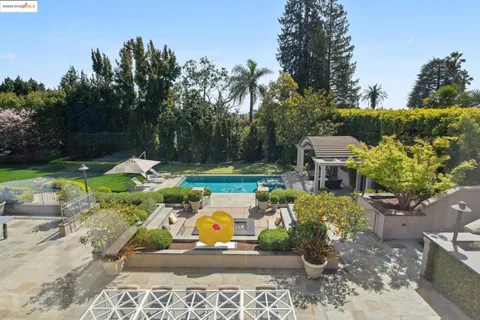 a view of a swimming pool with sitting area