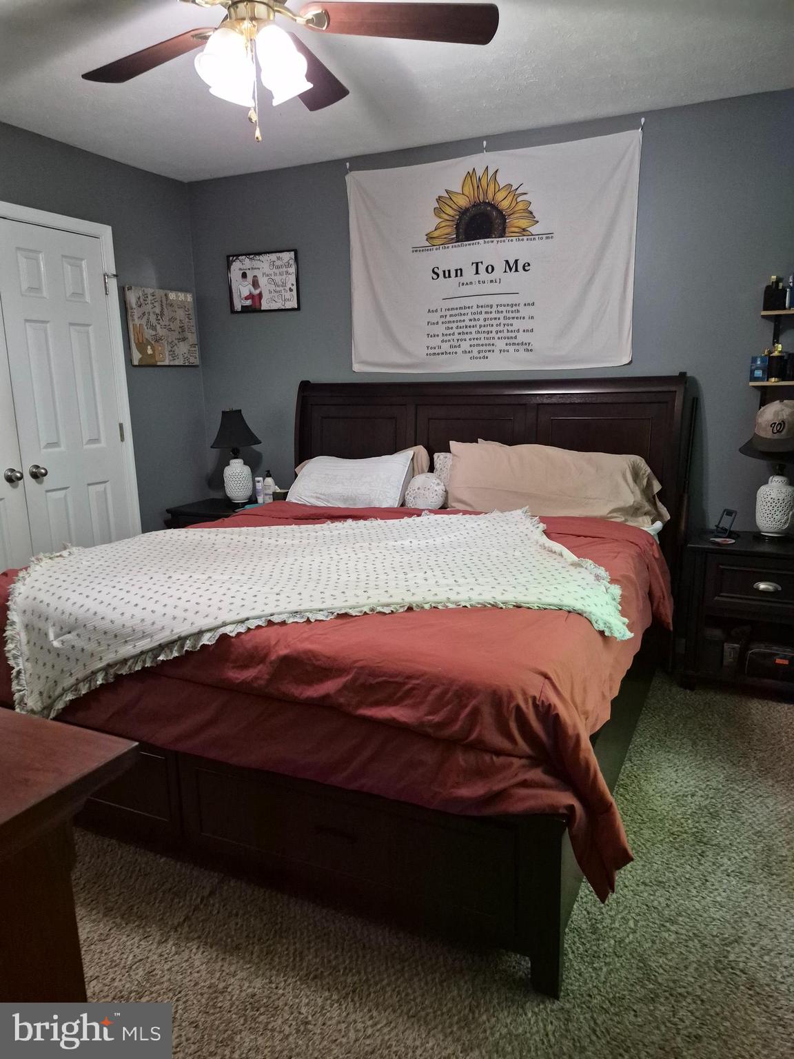 1440 Drummer Hill Road Front Royal, VA 22630 - Photo 38 of 42 a bedroom with a bed and a wall painting