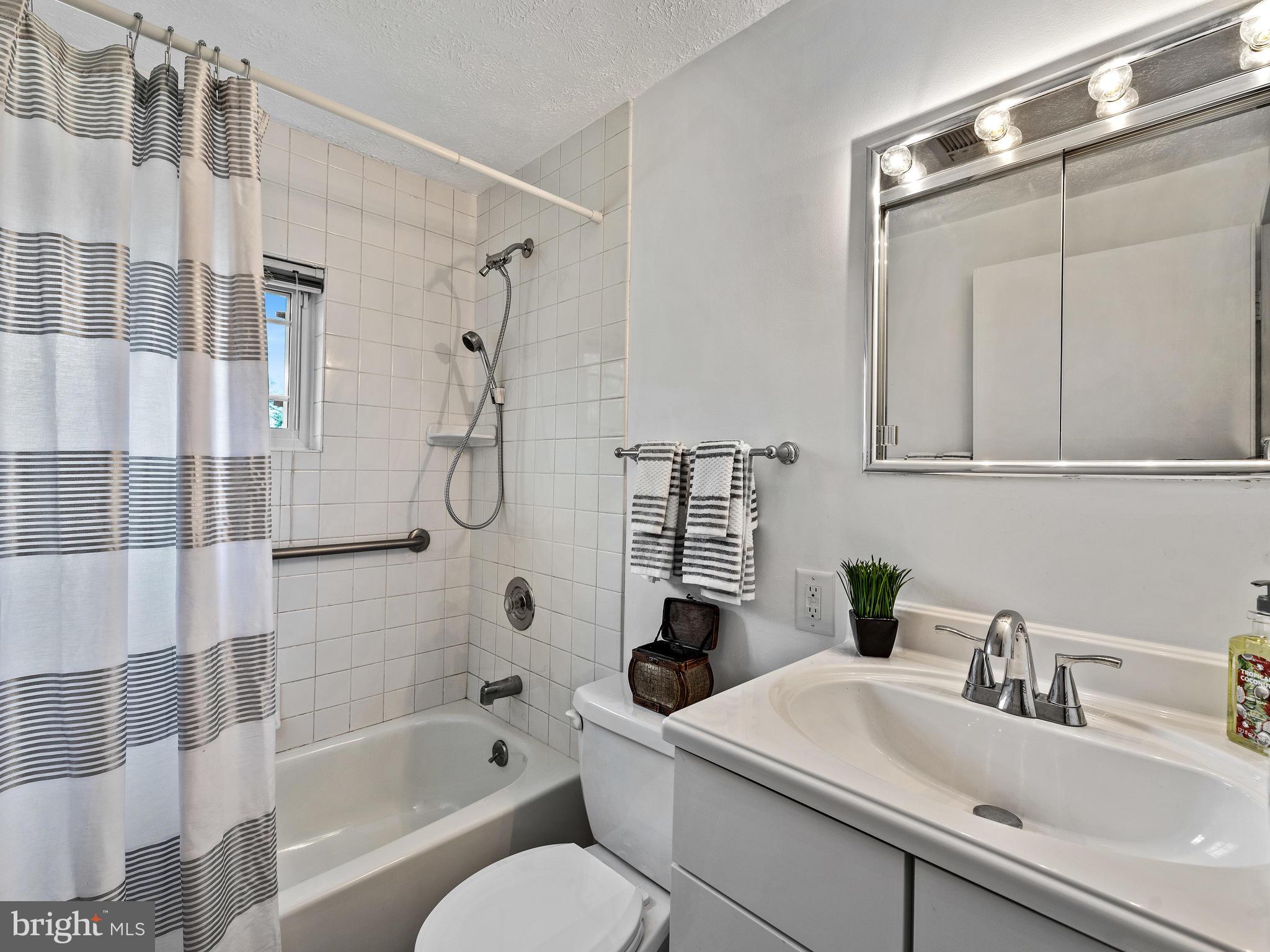 2409 Alma Road Baltimore, MD 21227 - Photo 14 of 28 Updated bathroom with ceramic tile