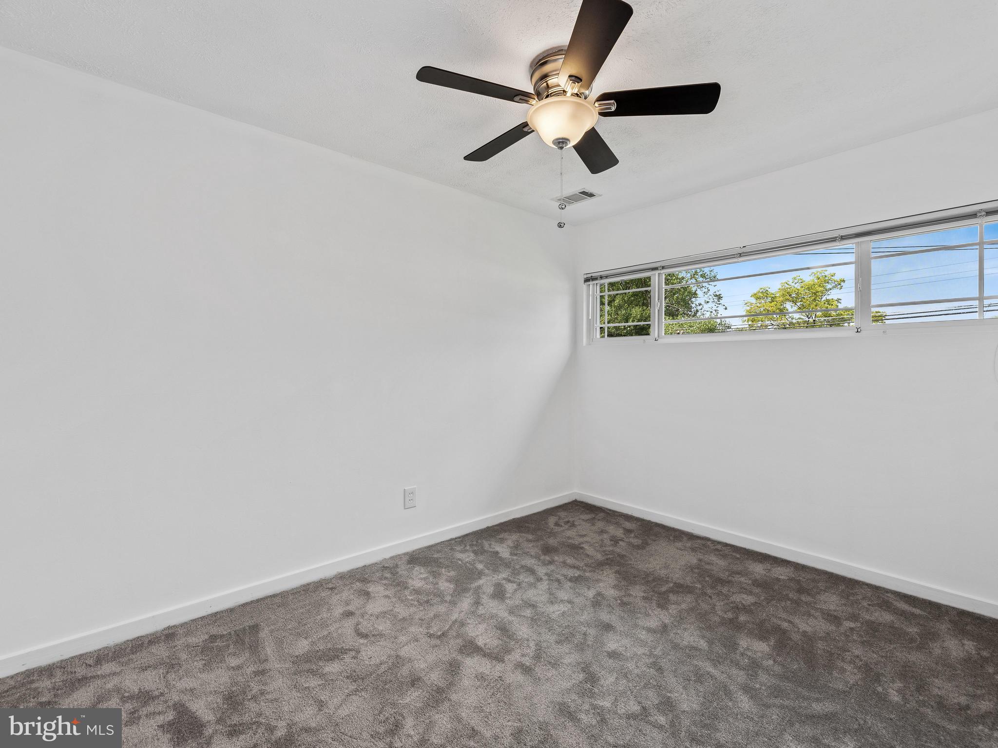 2409 Alma Road Baltimore, MD 21227 - Photo 16 of 28 Bedroom #2 w/ new ceiling fan & carpet