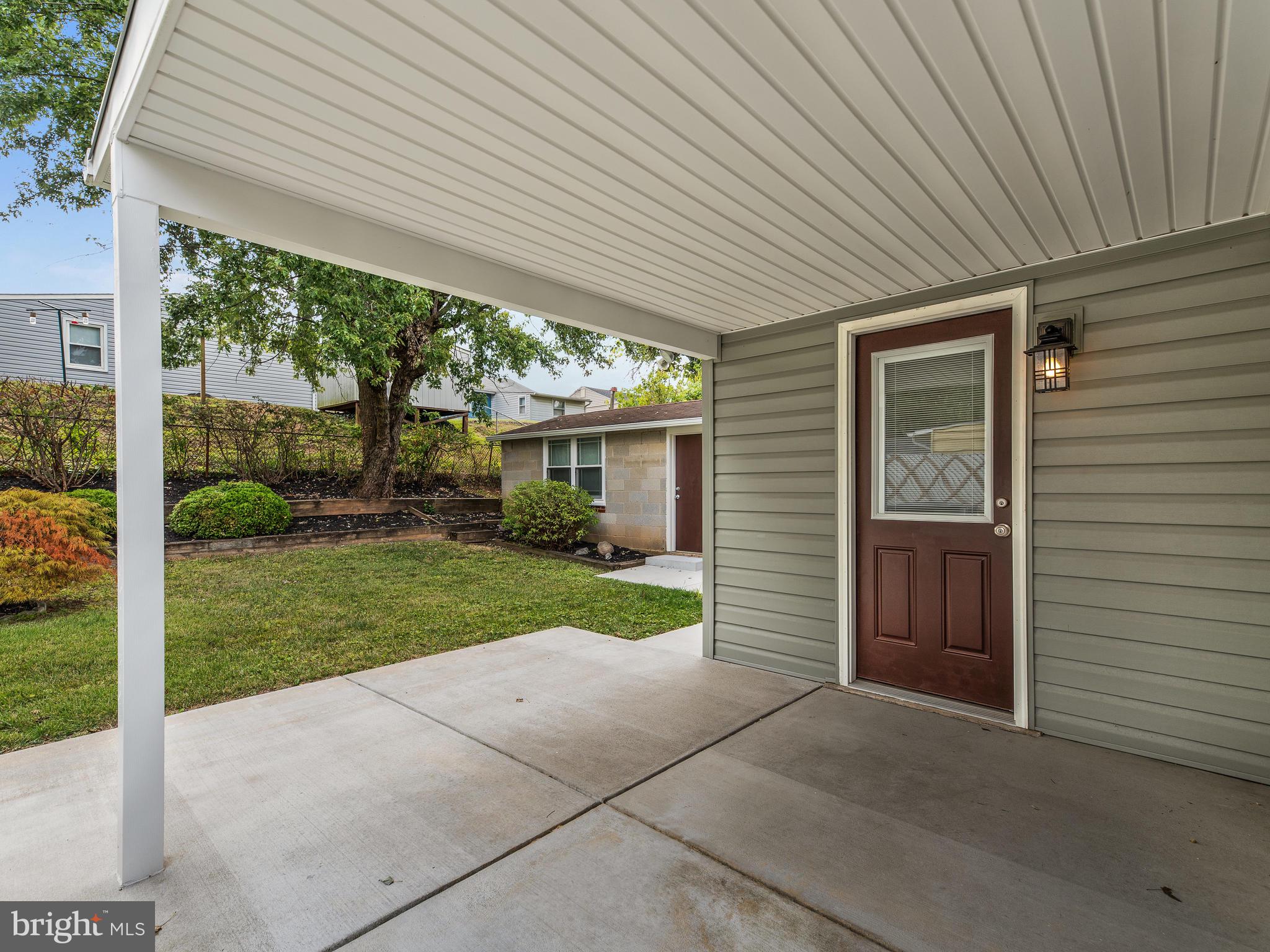 2409 Alma Road Baltimore, MD 21227 - Photo 24 of 28 Rear exterior door leads to new covered patio.