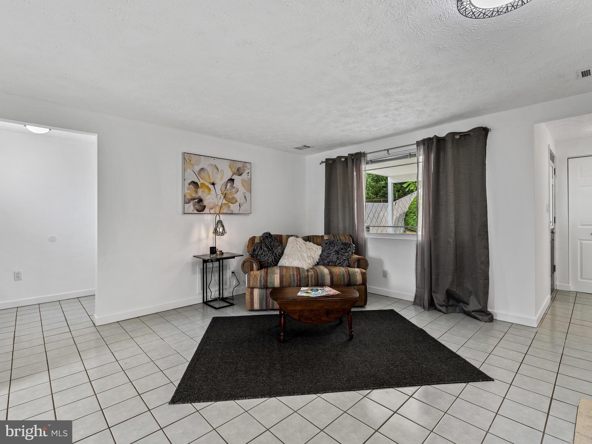 Spacious living room with large bay window
