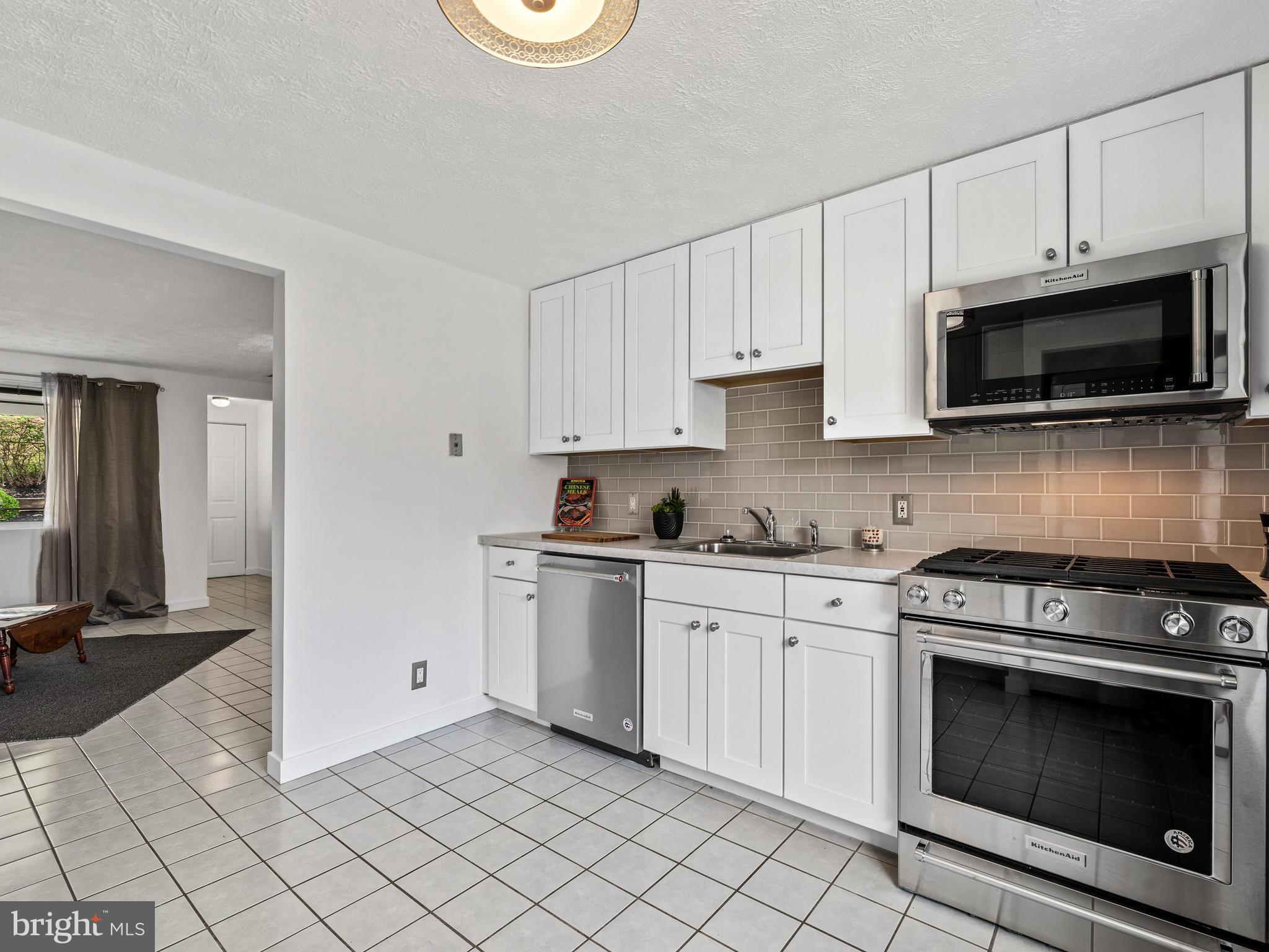 Crisp new white cabinets & light fixtures thru-out