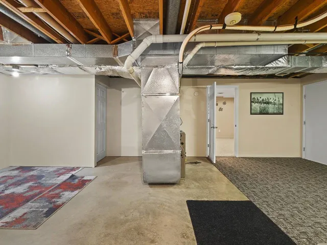 a view of a hallway with wooden floor and entryway