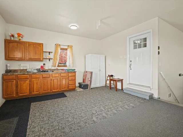 a view of a livingroom with furniture and window