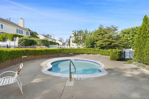 a view of swimming pool from a yard