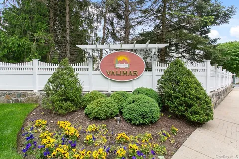 a backyard of a house with a garden and plants