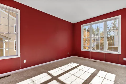 a view of a big room with windows