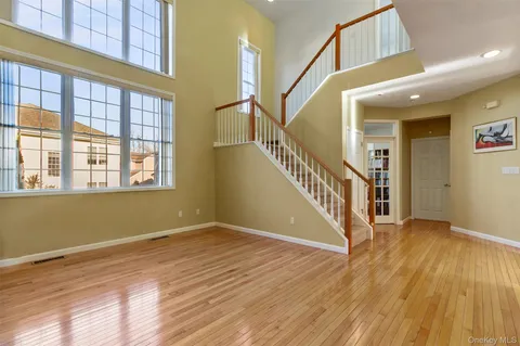 a view of an entryway with wooden floor