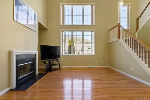 a view of a livingroom with furniture and a fireplace