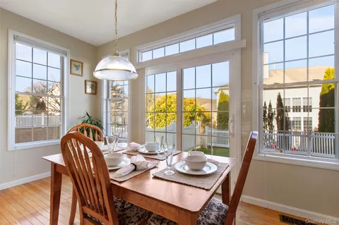 a dining room with furniture window wooden floor