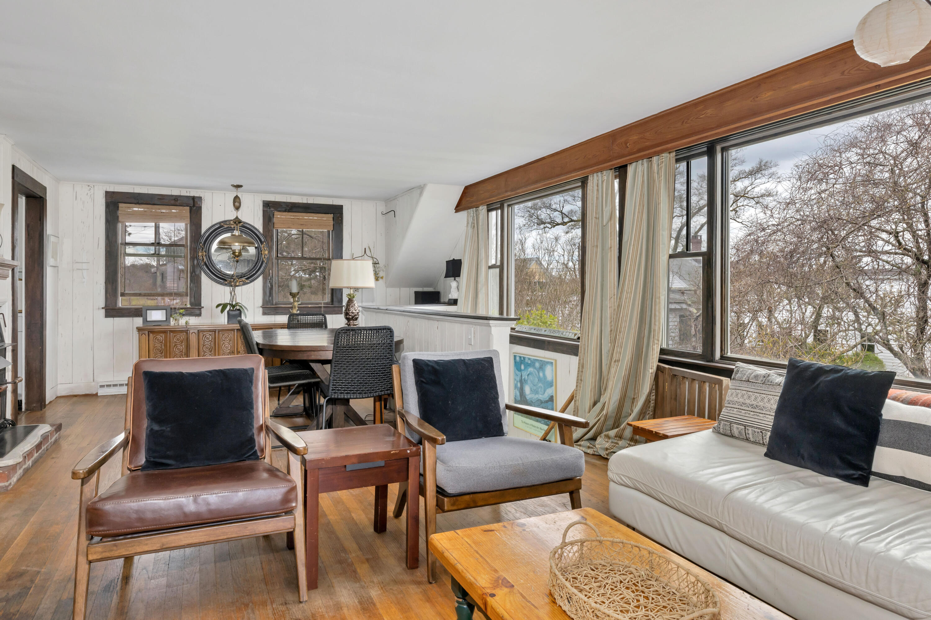 65 Depot Road Truro, MA 02666 - Photo 12 of 37 a living room with furniture and a large window
