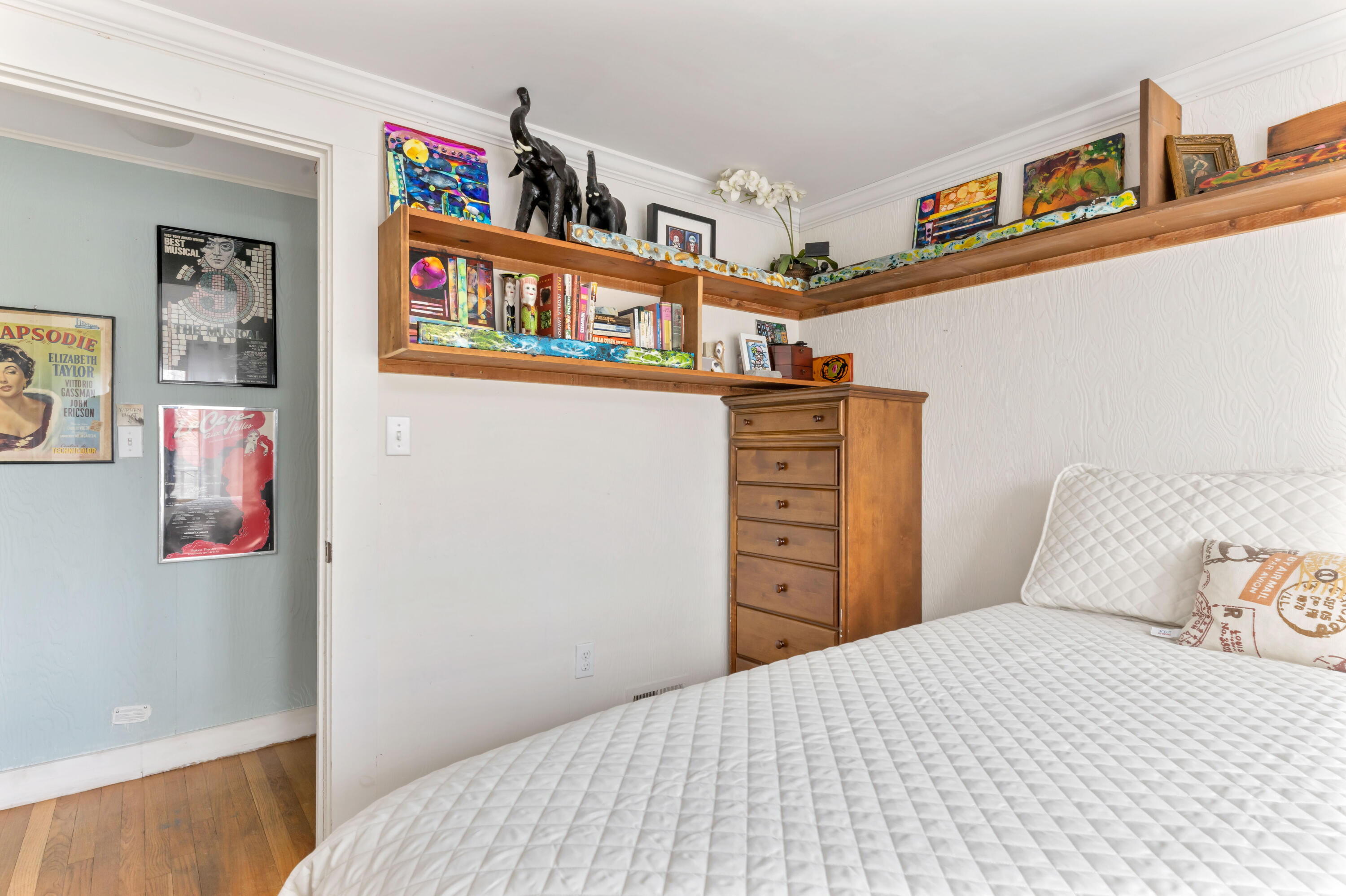 65 Depot Road Truro, MA 02666 - Photo 14 of 37 a bedroom with a bed and book shelf