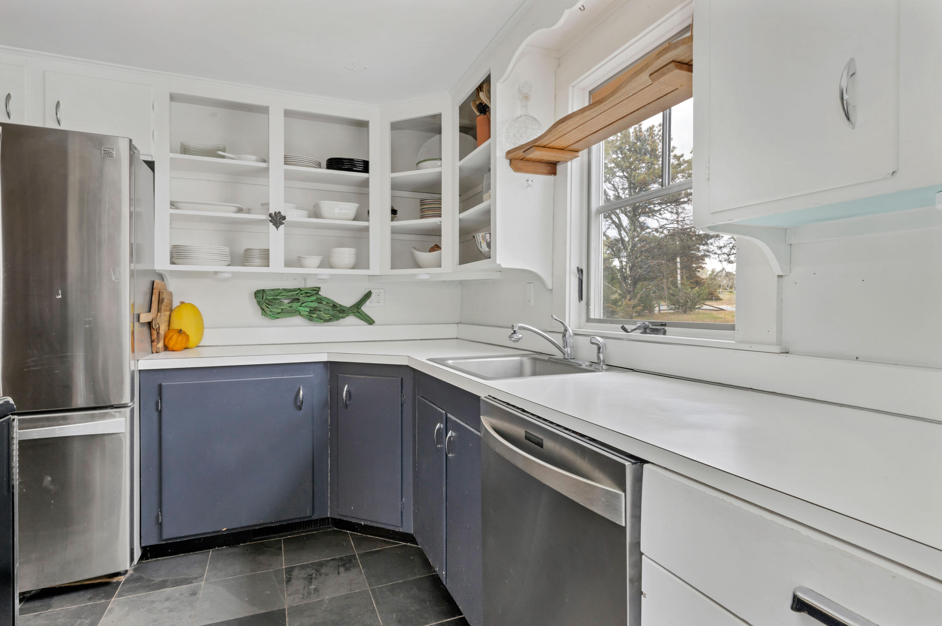 65 Depot Road Truro, MA 02666 - Photo 7 of 37 a kitchen with stainless steel appliances a sink and a refrigerator