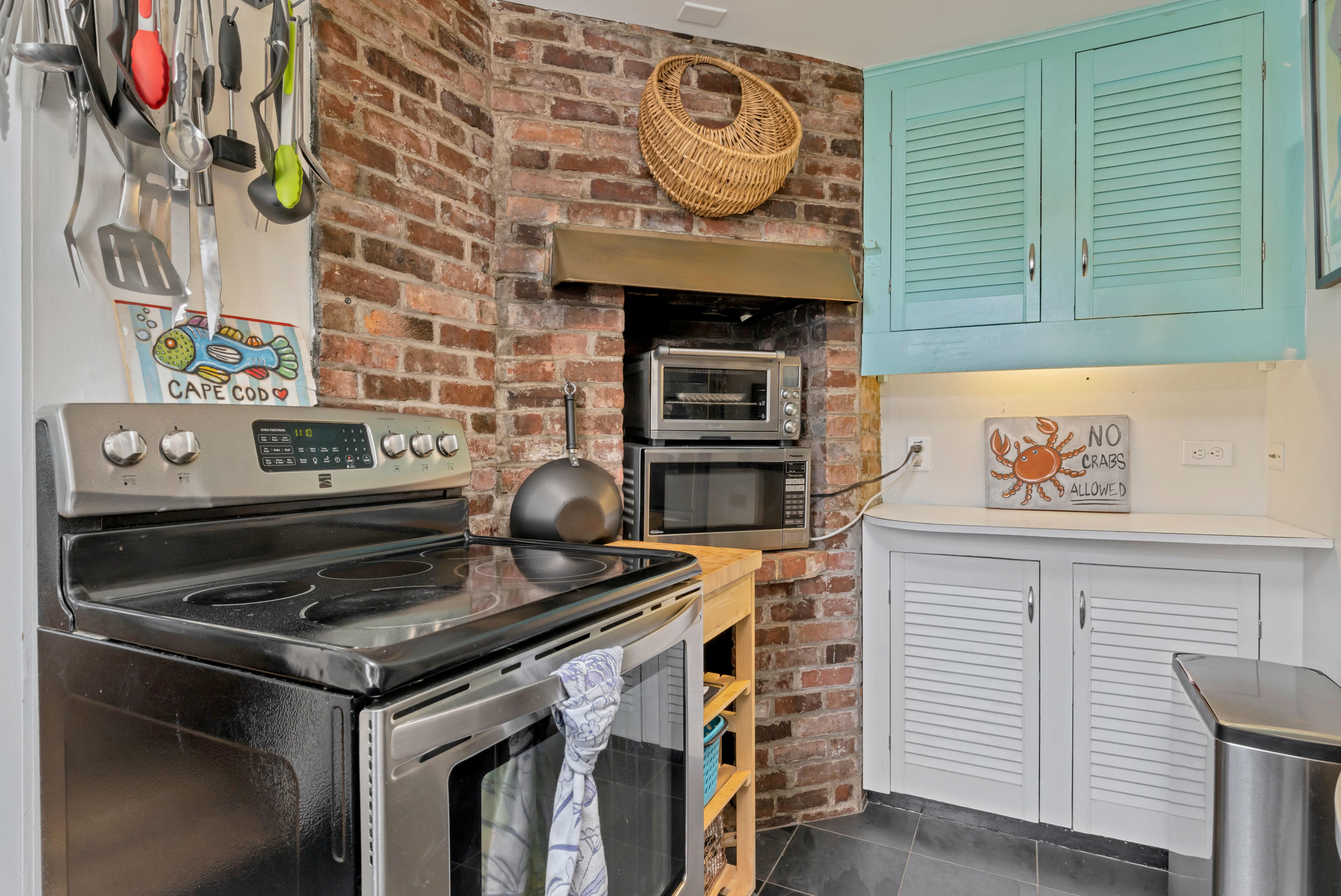 65 Depot Road Truro, MA 02666 - Photo 8 of 37 a stove top oven sitting inside of a kitchen