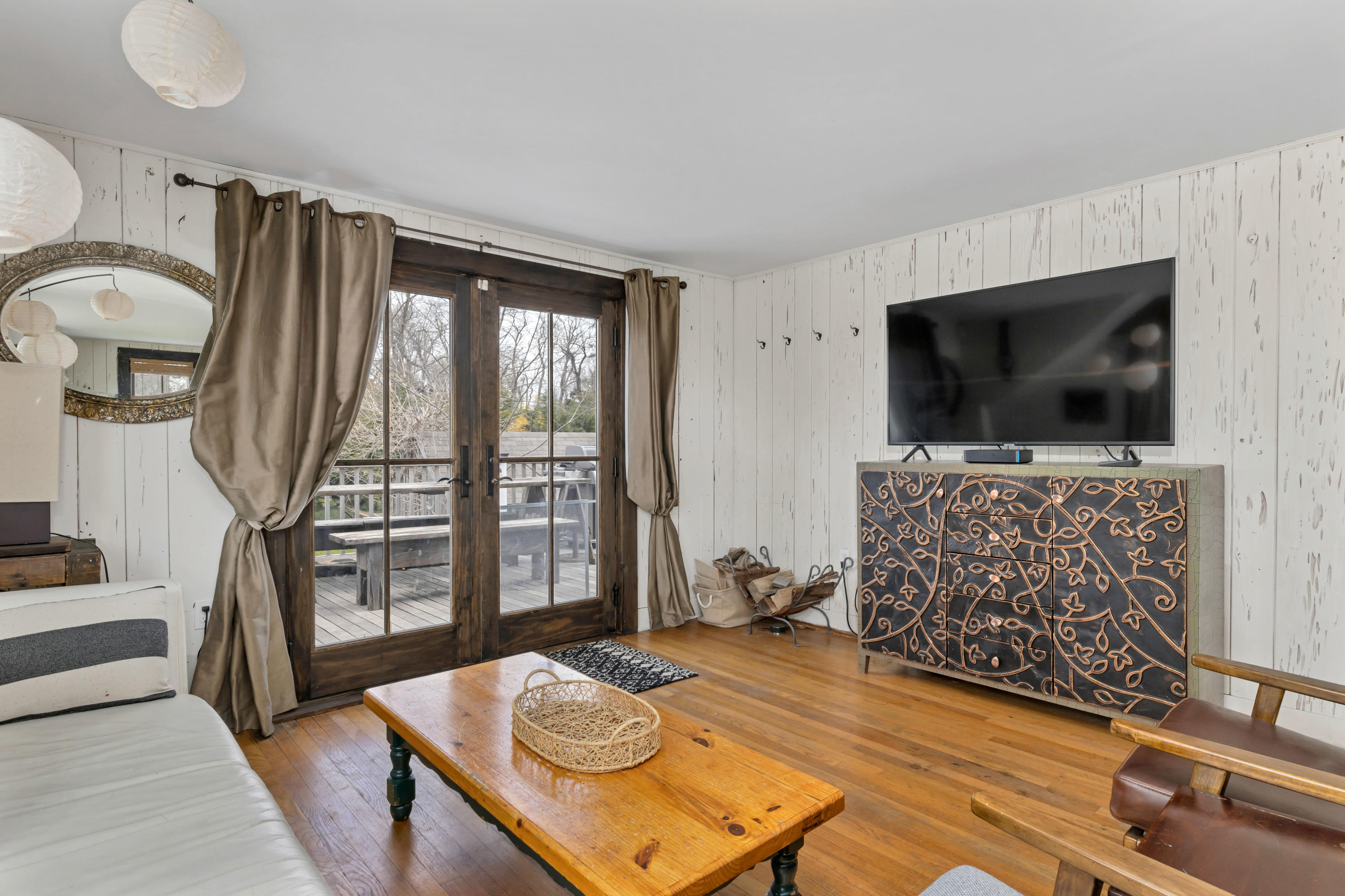 65 Depot Road Truro, MA 02666 - Photo 9 of 37 a living room with furniture and a flat screen tv