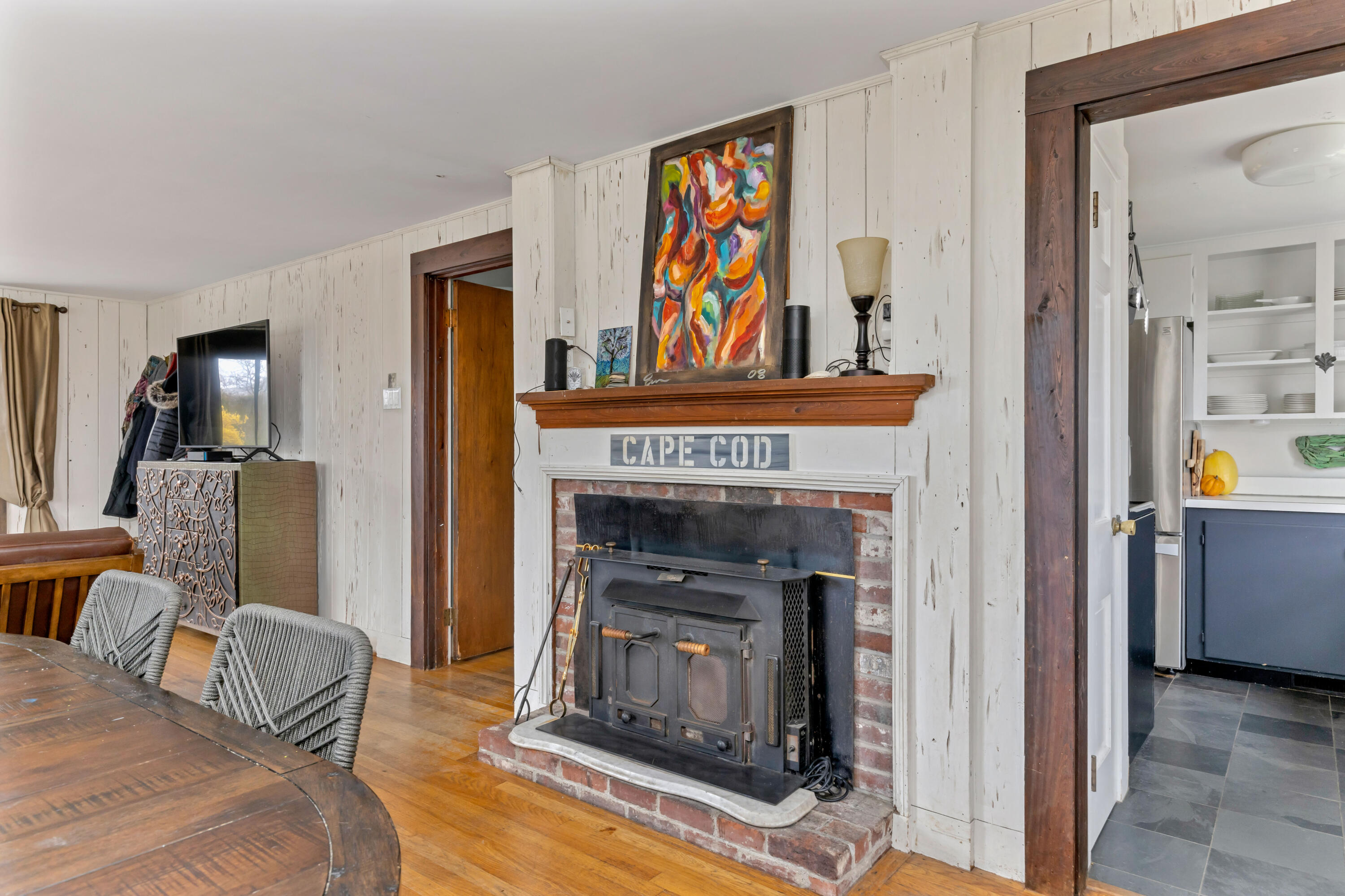 65 Depot Road Truro, MA 02666 - Photo 10 of 37 a living room with furniture and a fireplace