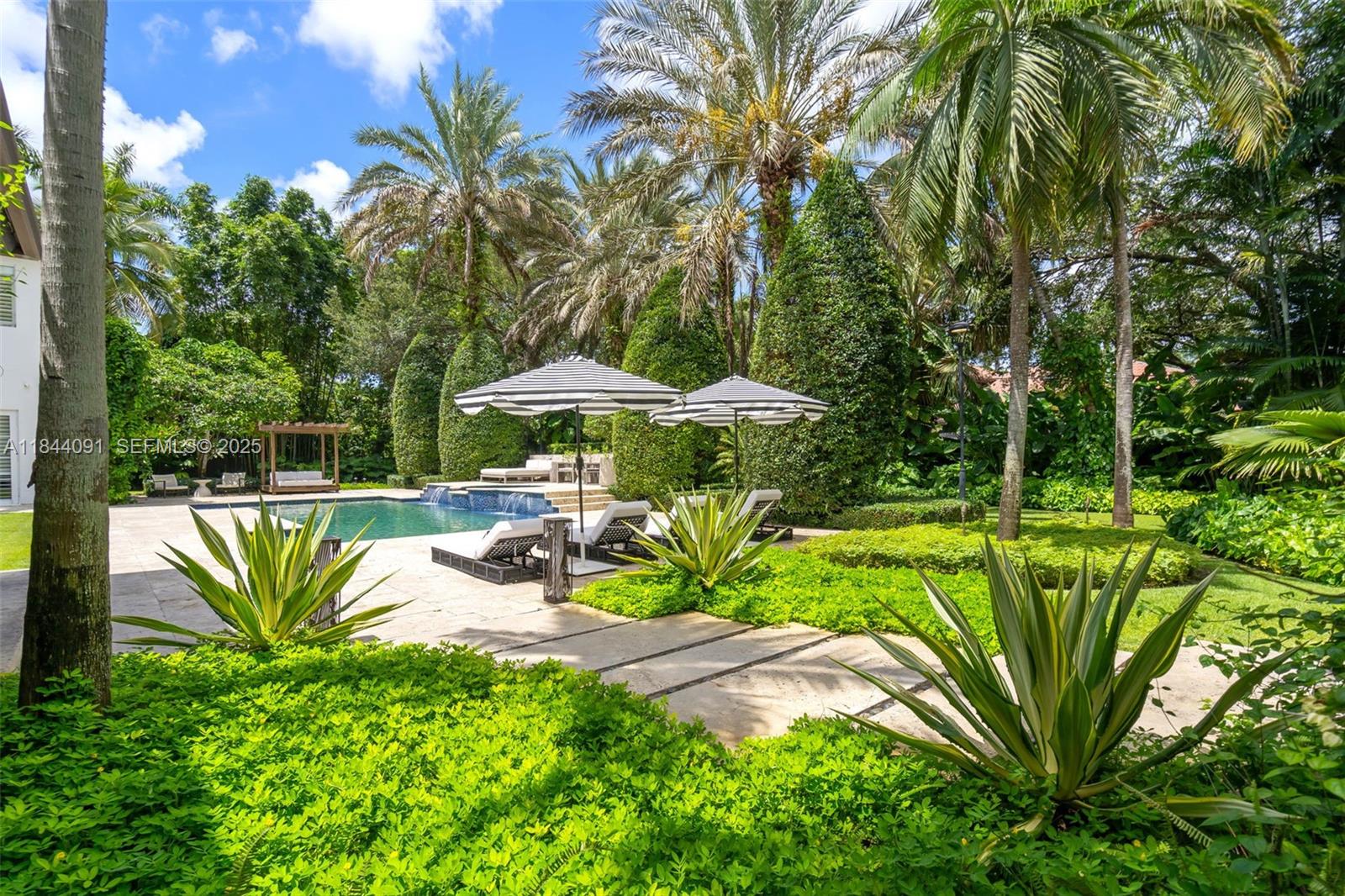 7320 Southwest 79th Court Miami, FL 33143 - Photo 17 of 89 a view of a swimming pool with a patio