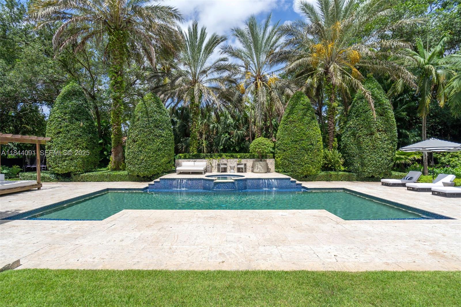 7320 Southwest 79th Court Miami, FL 33143 - Photo 2 of 89 a view of a yard with palm trees