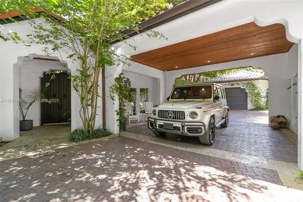 a kitchen with stainless steel appliances granite countertop a sink a stove and a wooden floors