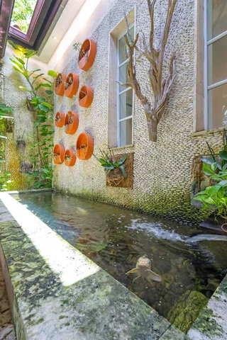 a large kitchen with stainless steel appliances kitchen island granite countertop a sink and cabinets