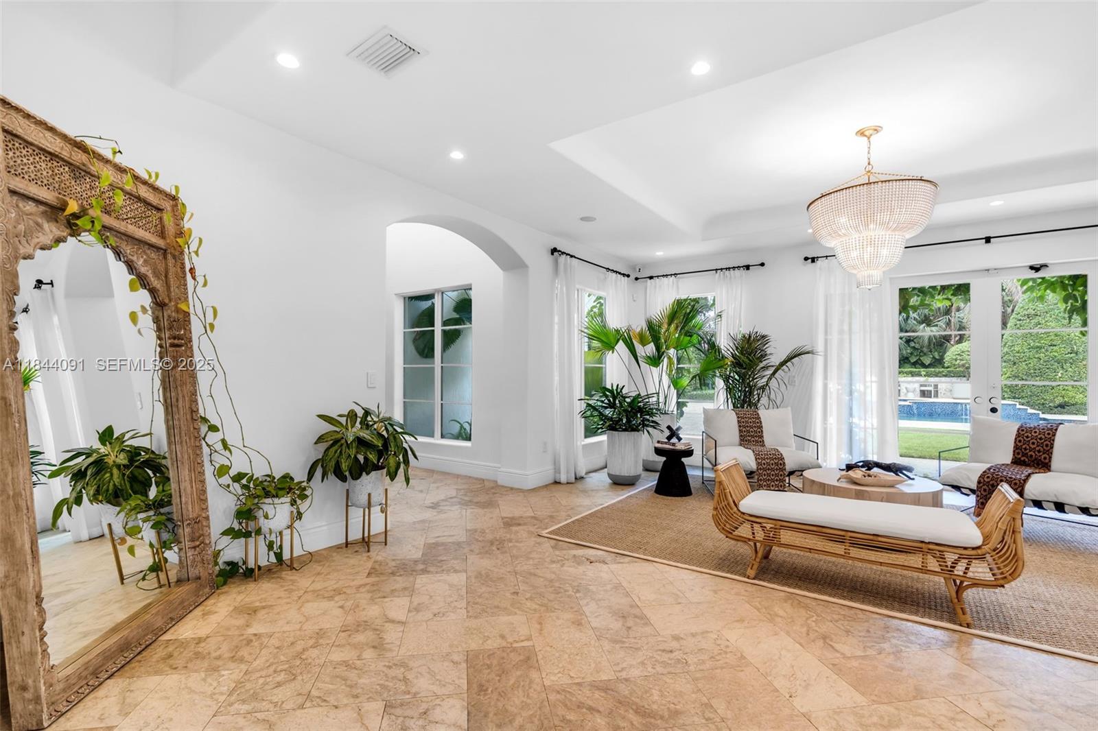 7320 Southwest 79th Court Miami, FL 33143 - Photo 28 of 89 a living room with furniture potted plant and a large window