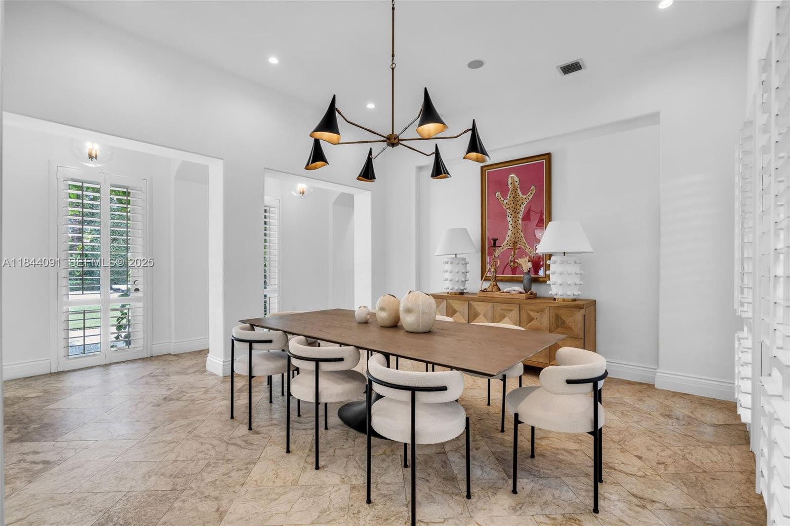 7320 Southwest 79th Court Miami, FL 33143 - Photo 34 of 89 a view of a dining room with furniture window and wooden floor