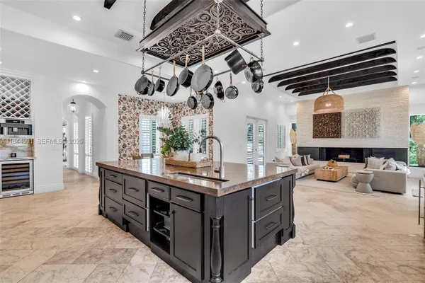 a bedroom with furniture and a large window