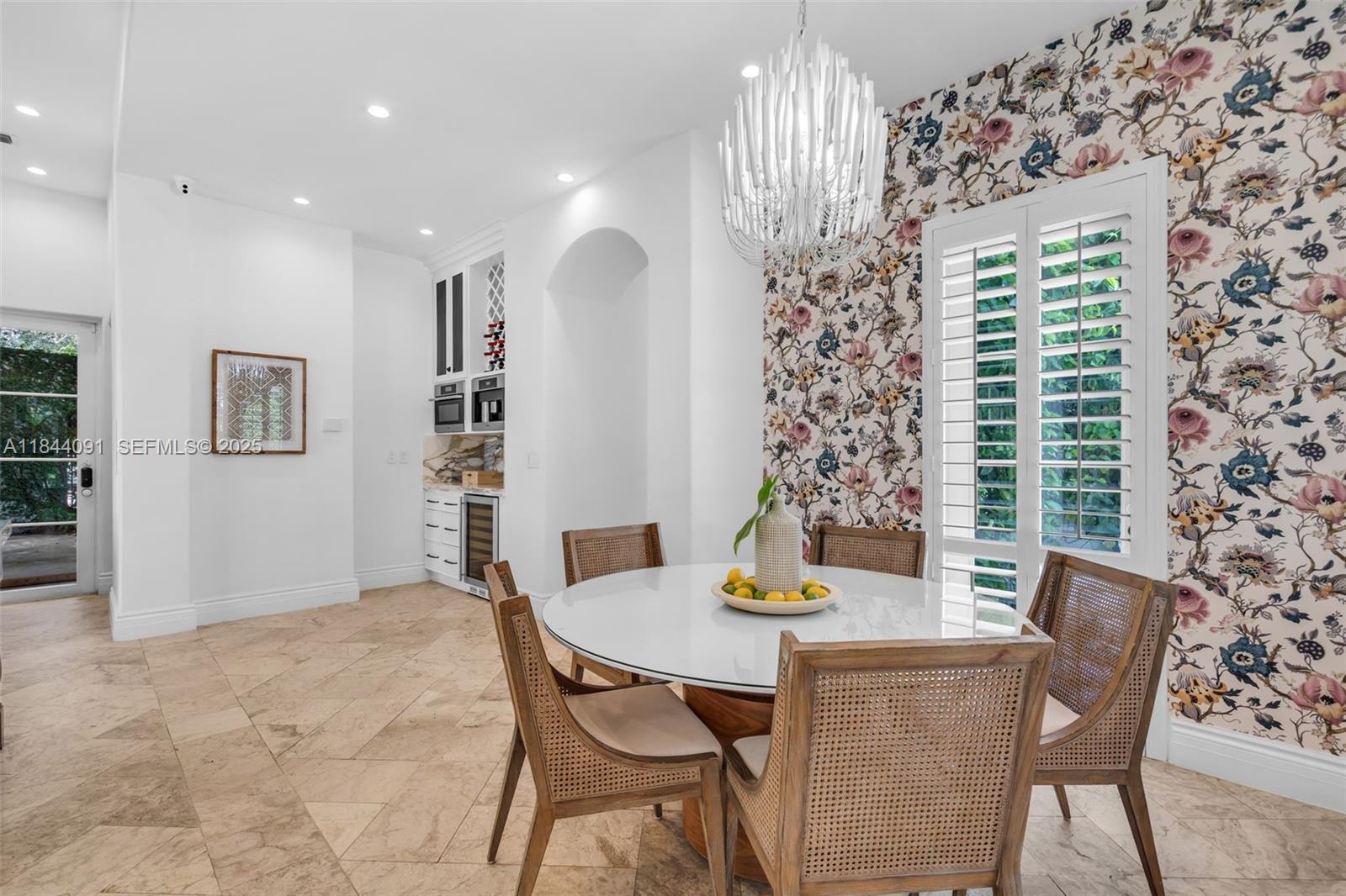 7320 Southwest 79th Court Miami, FL 33143 - Photo 37 of 89 a view of a dining room with furniture and chandelier