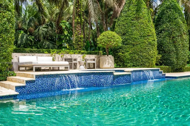 a view of a backyard with a sitting area