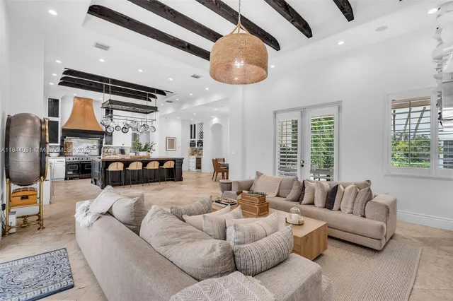 a living room with furniture and a bookshelf