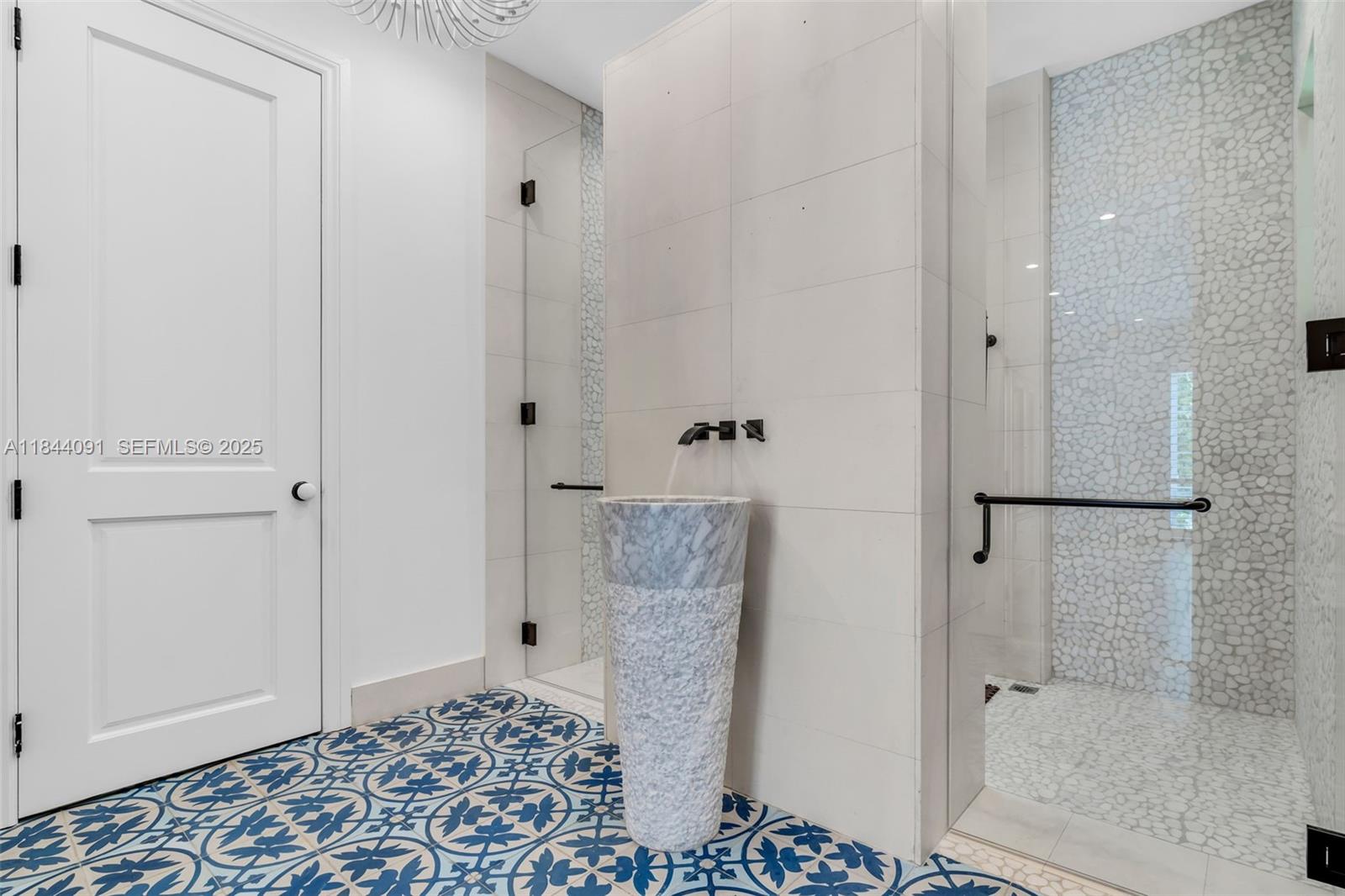 7320 Southwest 79th Court Miami, FL 33143 - Photo 50 of 89 a bathroom with a shower