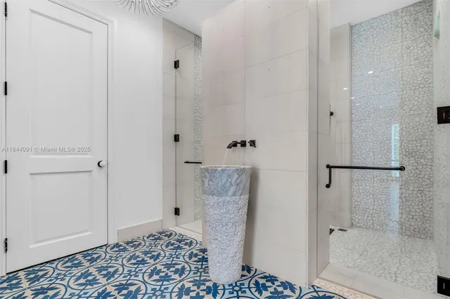 an aerial view of residential house with outdoor space and trees all around