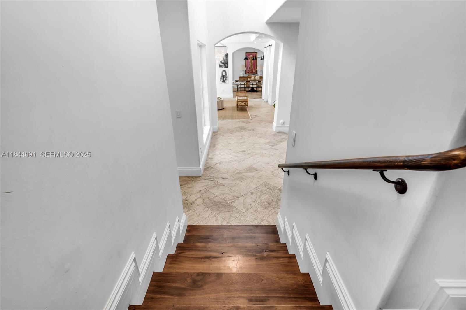 7320 Southwest 79th Court Miami, FL 33143 - Photo 54 of 89 a view of a hallway with wooden floor and staircase
